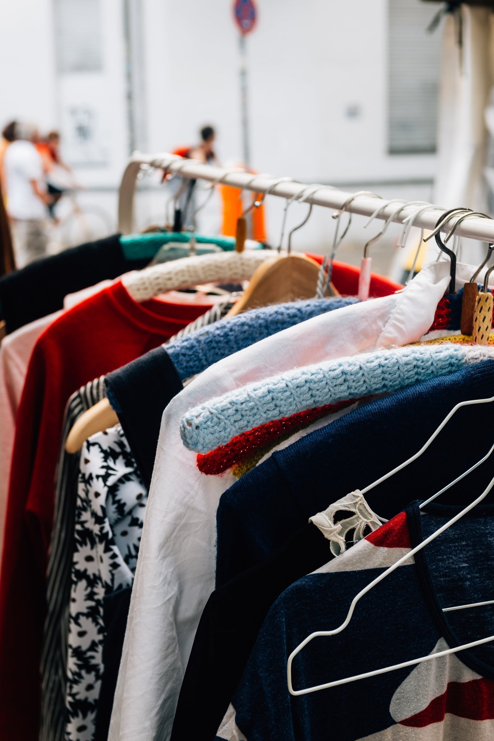 Colorful assortment of casual and patterned clothing on a clothing rack, ideal for building a versatile wardrobe for everyday style.