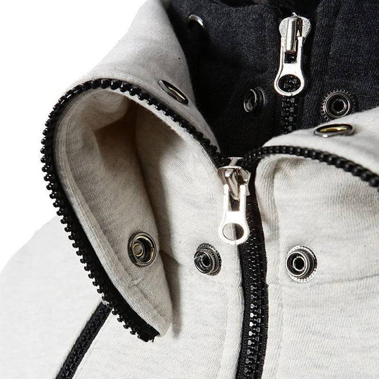 Close-up of men's zip-up hooded jacket showing high-quality zippers and snap buttons, highlighting durable and stylish craftsmanship.