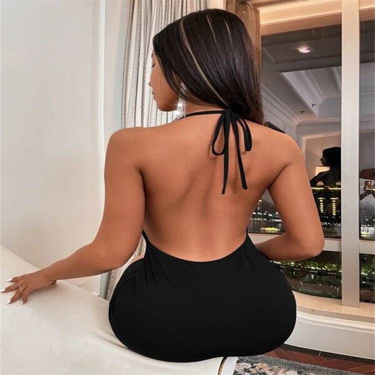 Black halter backless dress with deep scoop back, designed for summer elegance. Lightweight and stylish for warm weather events.