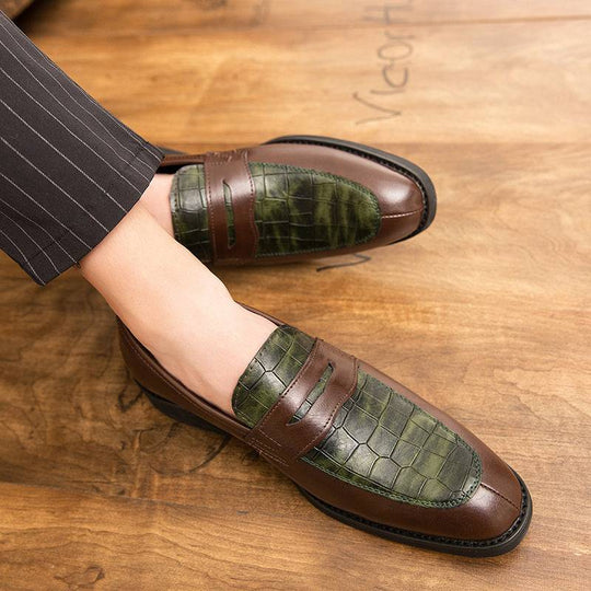Men's pointed leather shoes in brown with green crocodile-textured upper, blending Korean fashion with British elegance.