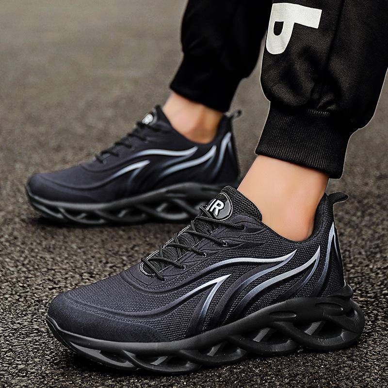 Black men's running casual shoes with mesh upper, dynamic white and black wave design, thick rubber sole, ideal for outdoor wear