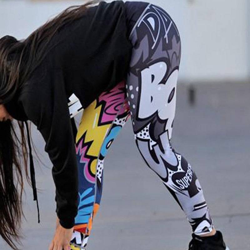 Woman stretching in stylish printed yoga pants with bold graphic design, slim fit polyester leggings perfect for fitness or leisure.