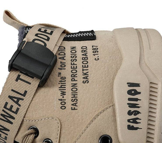 Close-up of beige men's high-top sneaker showcasing detailed branding and durable construction for casual streetwear fashion.