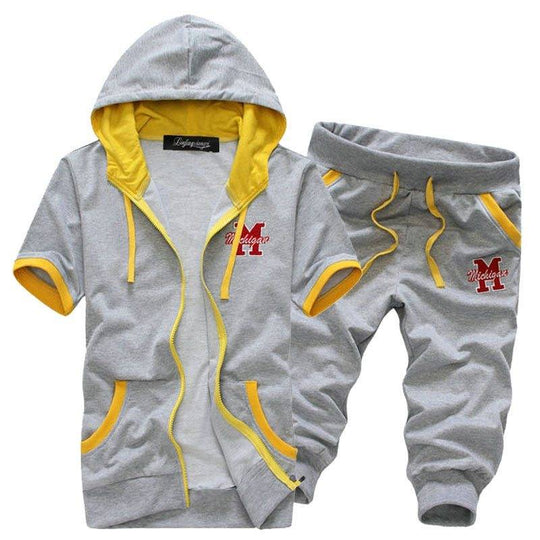 Men's hooded short sleeve sweater and shorts set in gray with yellow accents, featuring 'Michigan' embroidery for casual streetwear style.