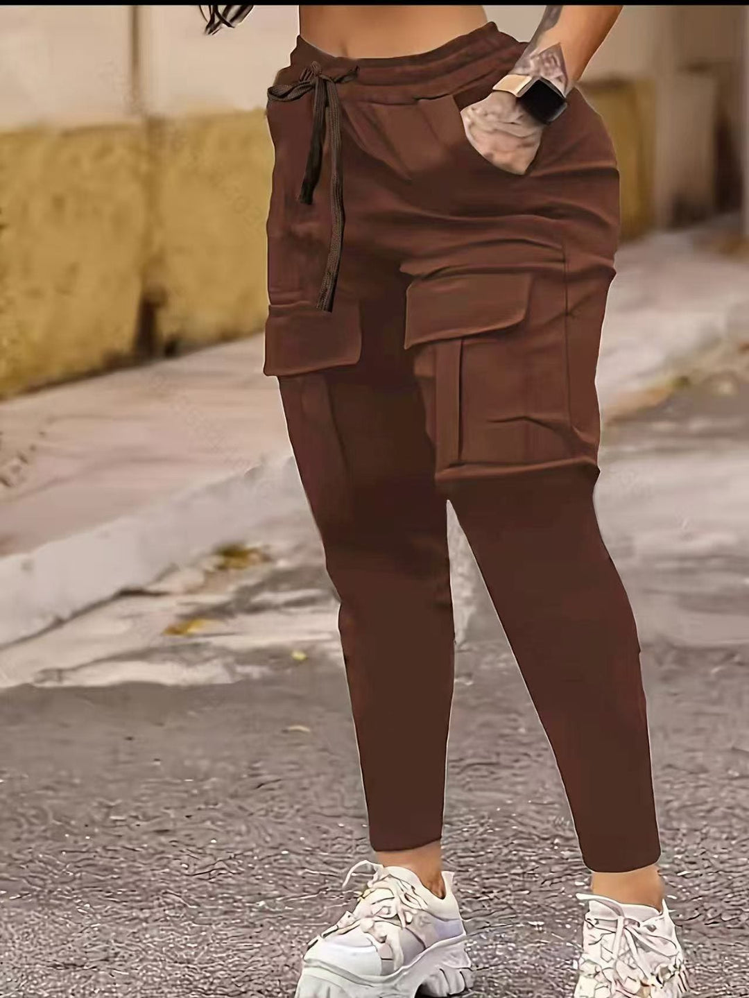 Brown European American solid work pants with side pockets and ankle bands, blending fashion and function for women’s daily wear.