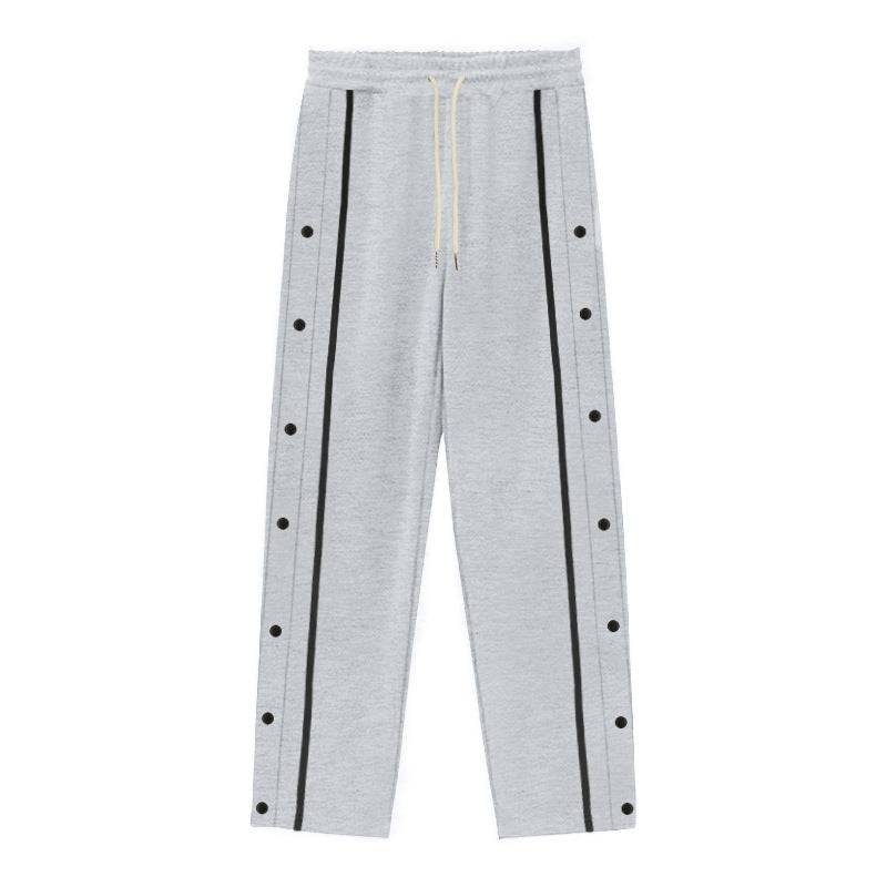 Flat-lay of gray men's casual sports pants with black side stripes and snap buttons, perfect for relaxed and athletic outfits.
