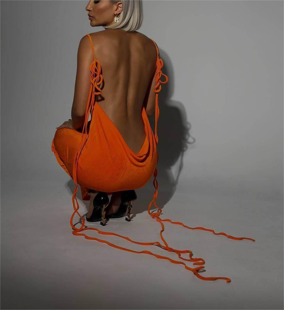 Bold orange Slim Backless Summer Dress with draped open back and long lace-up ties. Perfect for standout summer fashion.