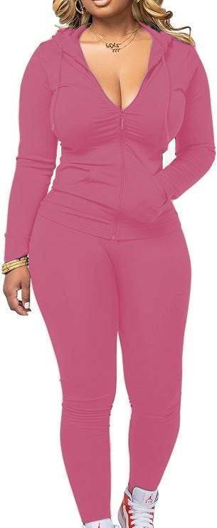 Pink women's fleece hoodie set with fitted leggings and zip-up top. Trendy and soft polyester outfit for casual comfort and style.