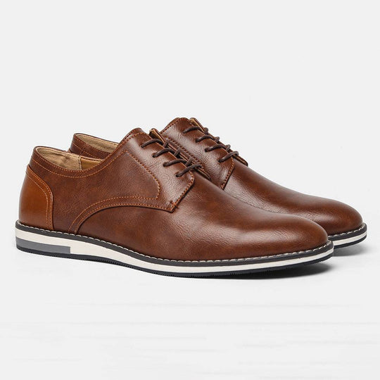 Brown leather-look plus size men’s shoes with breathable design and colorblock heel, suitable for casual and dress occasions.