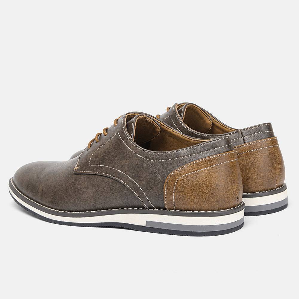 Rear angle of plus size men’s shoes with brown colorblock heel and cushioned collar, combining comfort and modern style.