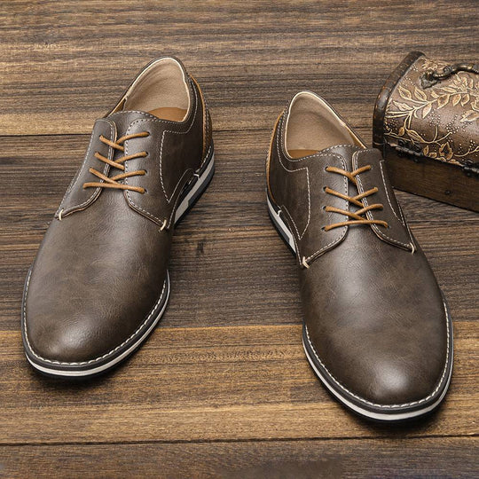 Front view of plus size men’s breathable shoes featuring a sleek brown colorblock style and durable stitching for everyday comfort.