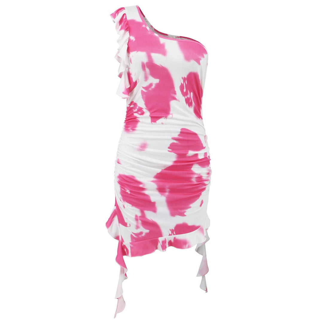 Pink tie-dye ruffle sheath dress displayed on a mannequin. One-shoulder short skirt with ruched sides and flowing hem.
