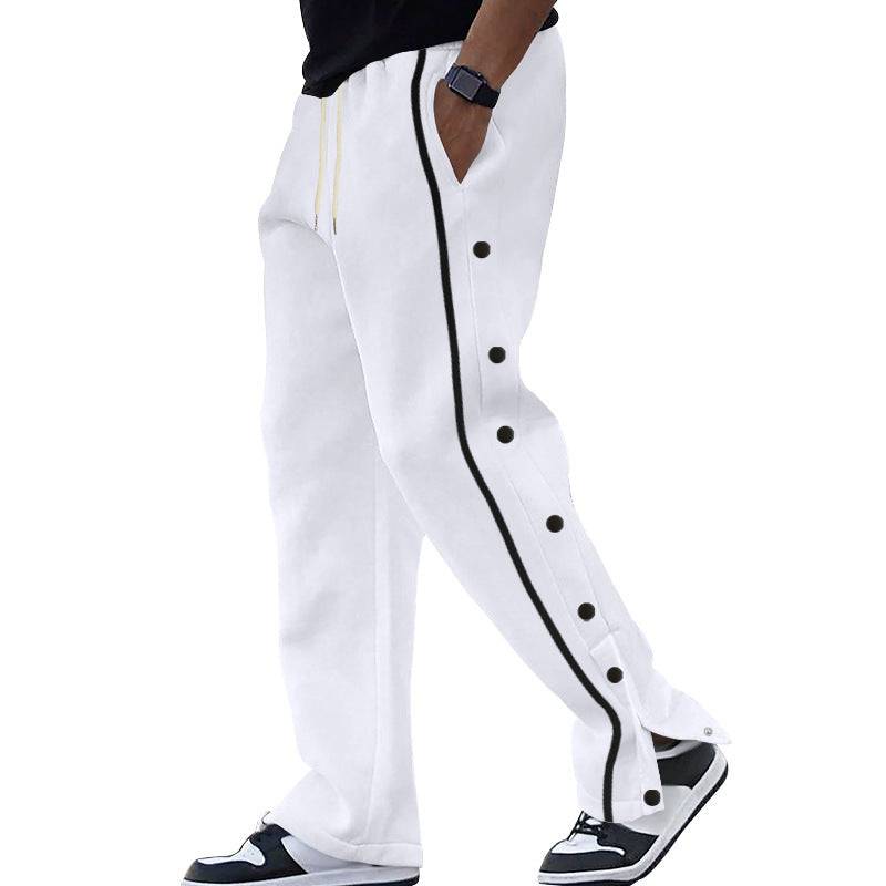 White men's casual sports pants with black side stripes and button details, styled for modern comfort and activewear appeal.
