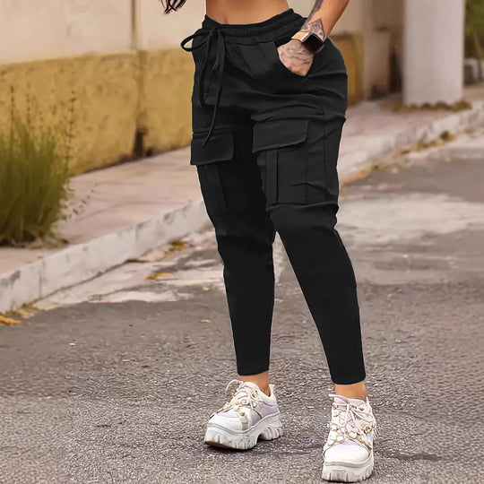 European American solid work pants with pockets in black, featuring ankle banded cuffs and cargo-style design for women’s casual wear.