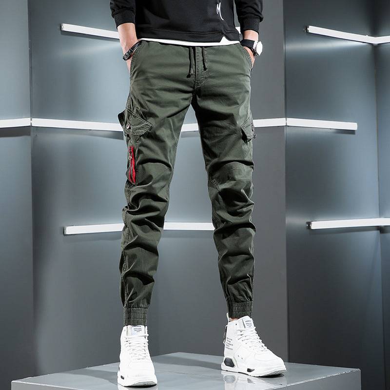 Men's slim overalls in army green with elastic waist and tapered legs, ideal for casual streetwear and modern fashion looks.