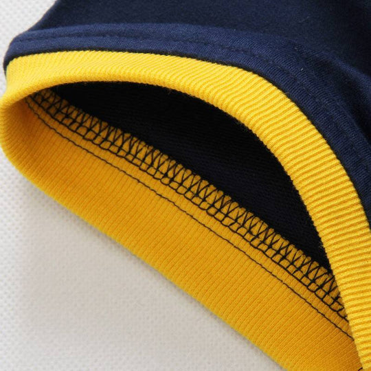 Close-up of yellow and navy sleeve hem stitching, highlighting quality craftsmanship in men's hooded short sleeve sweater.