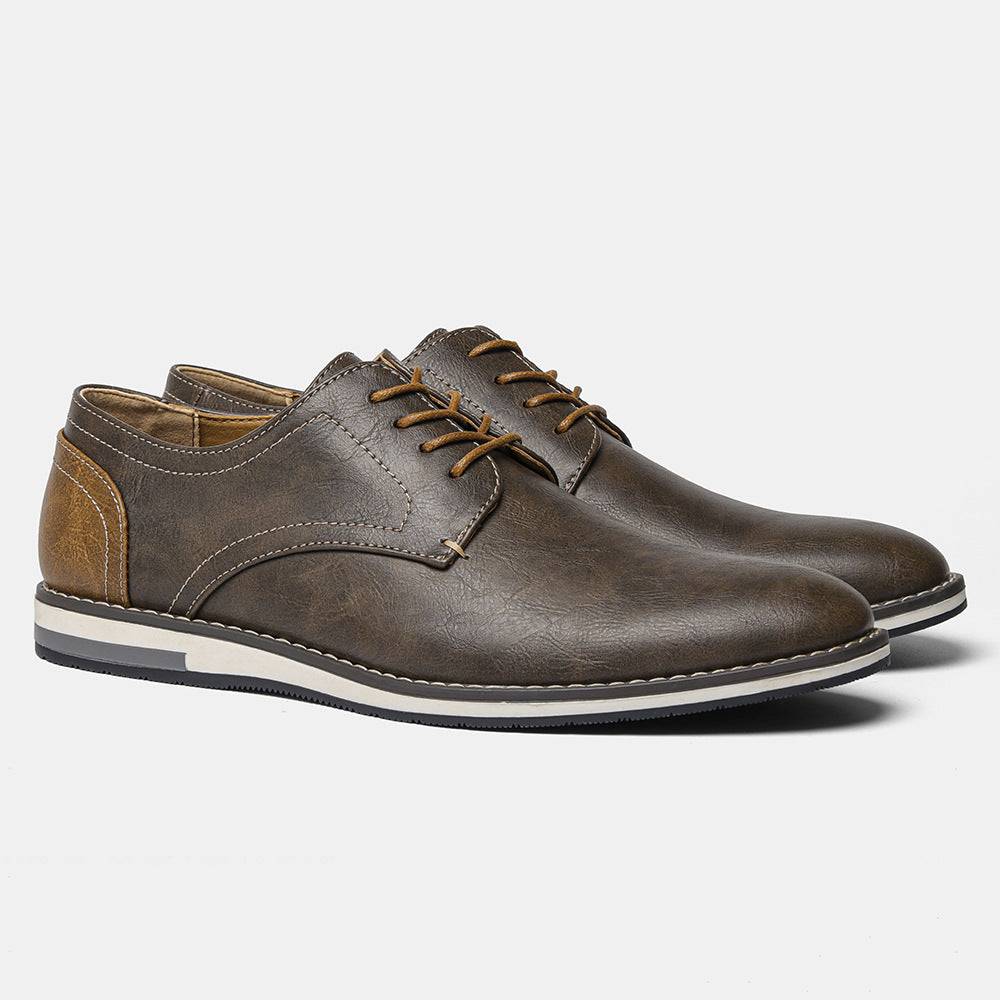 Angled view of brown plus size men’s breathable shoes with colorblock detail and white sole, ideal for versatile fashion looks.