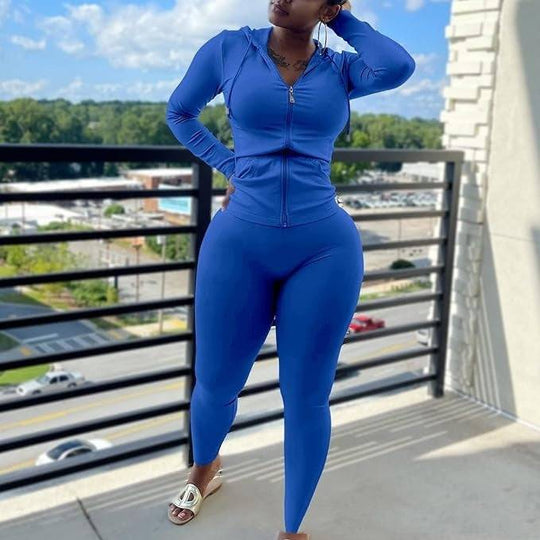 Women's fleece hoodie set in royal blue, featuring a zip-up hoodie and fitted leggings. Ideal casual polyester outfit for streetwear style.