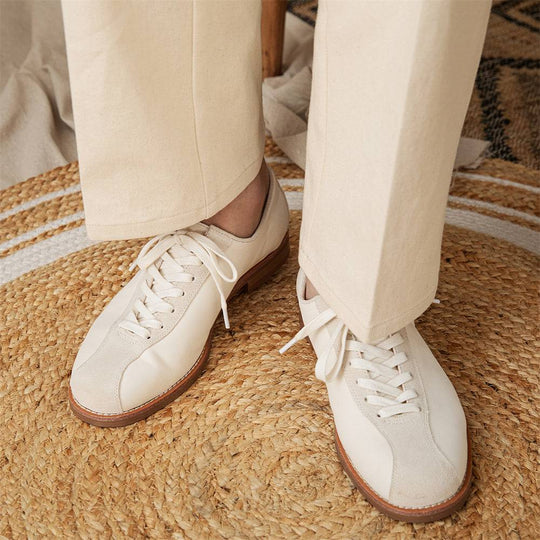 Men's vintage cowhide shoes styled with light trousers, emphasizing the durable sole and classic lace-up design for everyday wear.