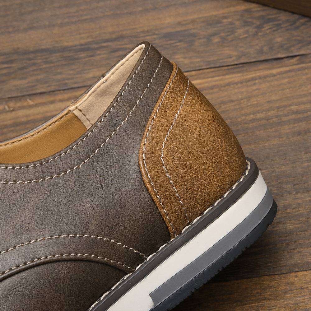 Close-up of heel detail on plus size men’s breathable shoes highlighting brown colorblock design and quality stitching.