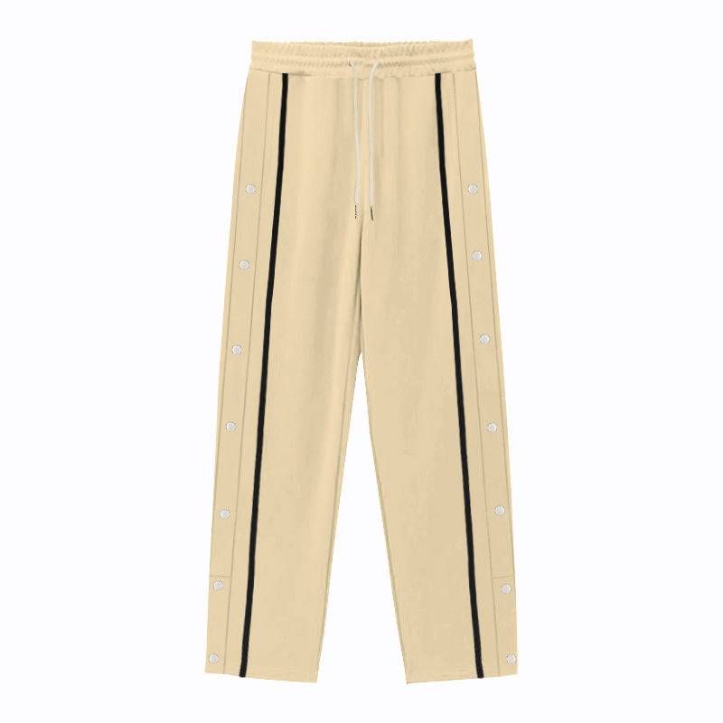 Flat-lay of beige men's casual sports pants with black side stripes and snap buttons, offering a relaxed and stylish fit.