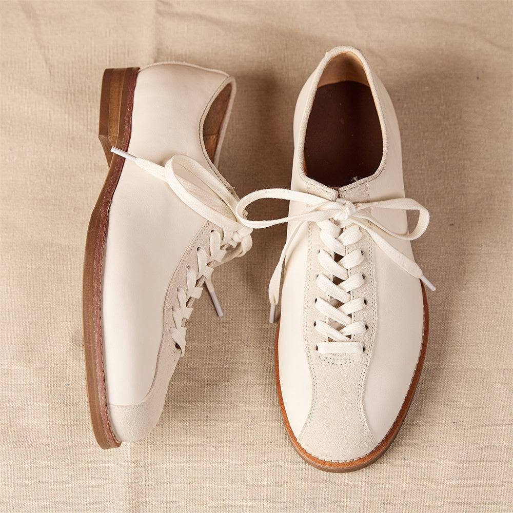 Top view of men's vintage cowhide shoes with contrast suede toe and leather body, featuring sturdy platform sole and elegant stitching.