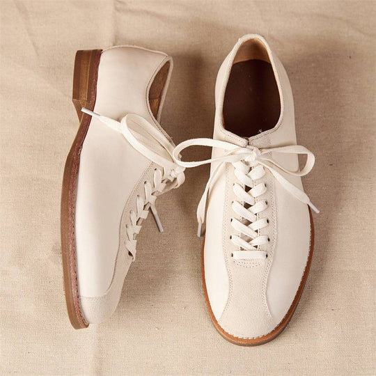 Top view of men's vintage cowhide shoes with contrast suede toe and leather body, featuring sturdy platform sole and elegant stitching.