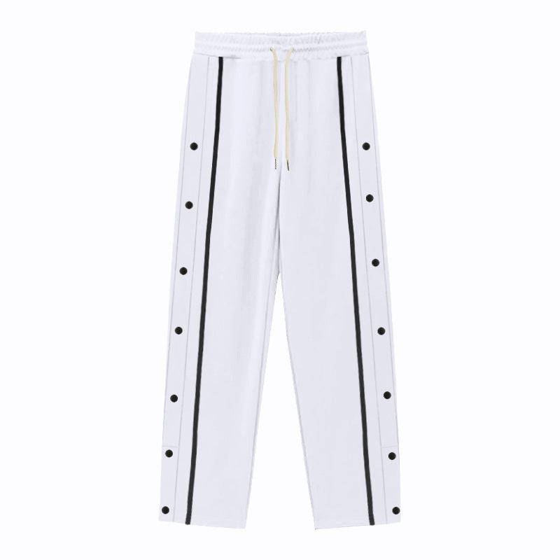 Flat-lay of white men's casual sports pants with black side stripes and button accents, perfect for versatile casual outfits.